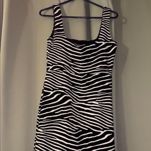 H&M dress.  Short about thigh length on woman who is 5’5.